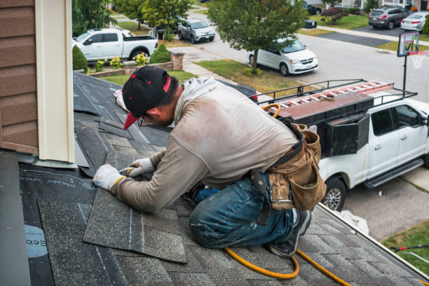 Professional Roofing technician working in Earling, IA